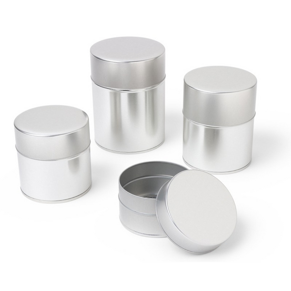 Set of silver metal containers on a white background