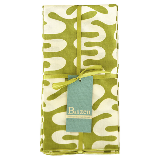 Folded green and white patterned napkin set