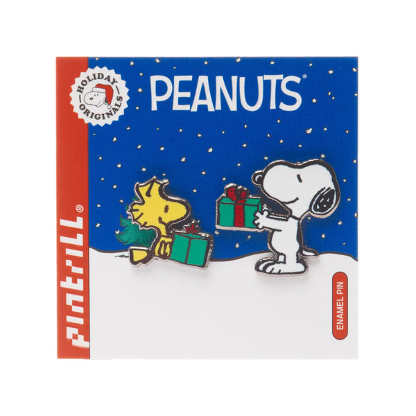 Peanuts-themed enamel pins on a blue card with 'Pintrill' branding.