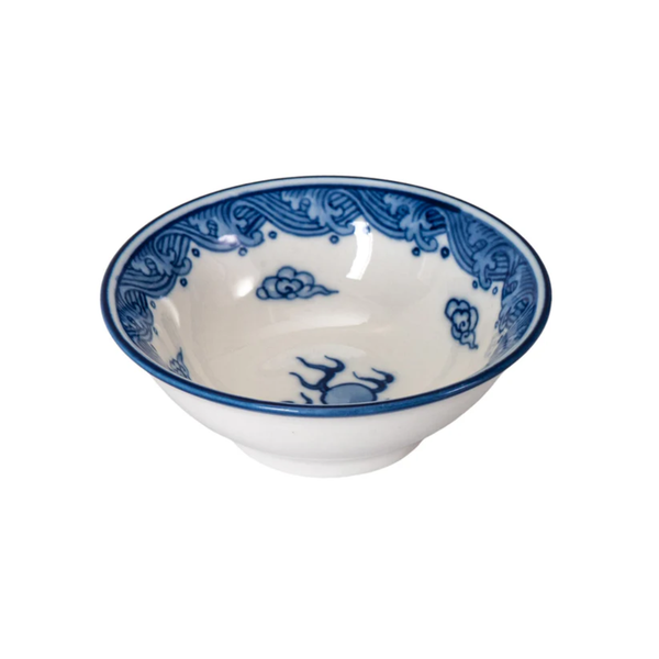 White ceramic bowl with blue decorative patterns on a white background