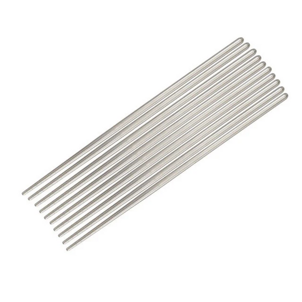 Set of metal chopsticks on a white background