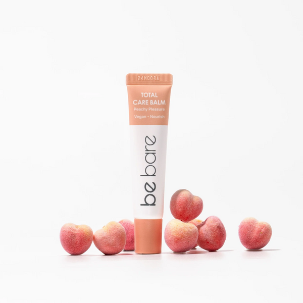Be bare Total Cake Balm with peach slices on a white background