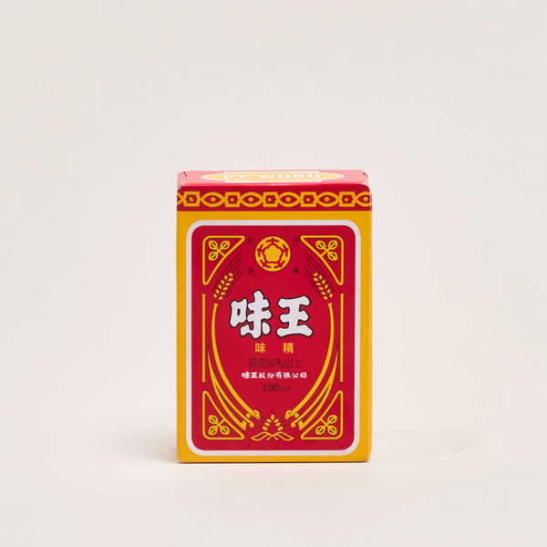A red and yellow rectangular box of Chinese food flavoring powder, featuring the brand name '愈奇' in white Chinese characters, set against a plain light gray background.