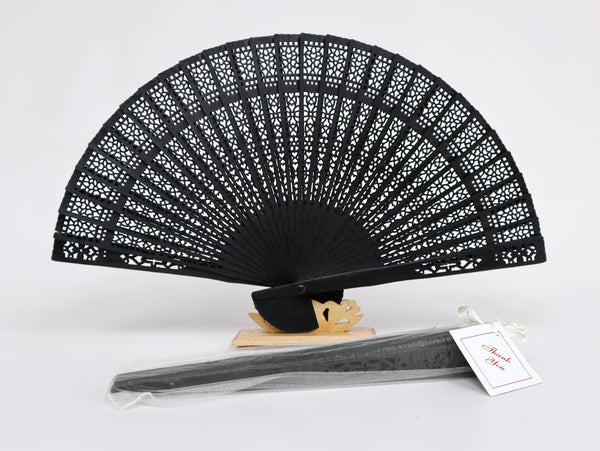 Black carved wooden fan with organza bag