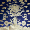 Gold brocade sea dragon on blue fabric