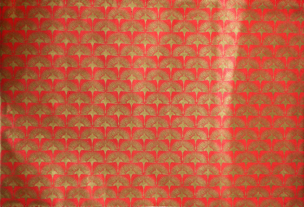 Red paper with gold crane design 
