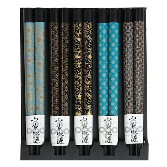 Five pairs of black chopsticks with assorted patterns.