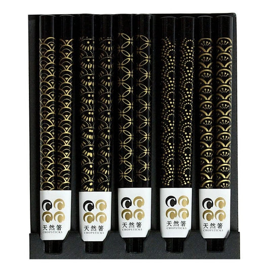 Five pairs of black chopsticks with assorted patterns.