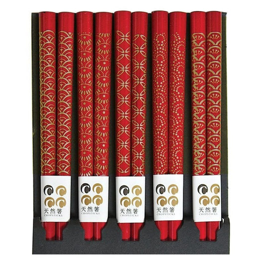 A set of red chopsticks with gold assorted patterns, displayed in a row.