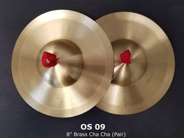 Two dome shaped brass cymbals