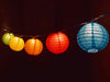 Close up of string of colorful mini lanterns lit up