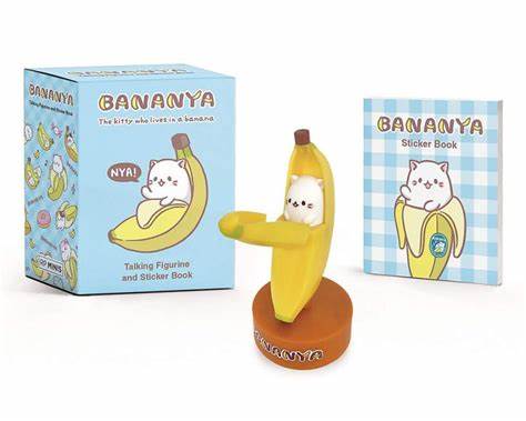 Bananya figurine with bananya container to its left and 16 page bananya sticker book to its left