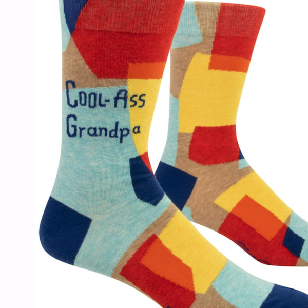 Cool-Ass Grandpa Novelty Socks: Bright socks in blues, reds. and yellows in rounded square shapes with "COOL-ASS GRANDPA"