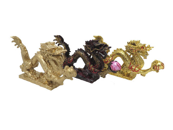 Three dragon with pearl statues. There's one in resin, gold and brass