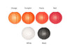 Wire frame spherical paper lantern. colors are orange, pumpkin, flame, red, white, and black