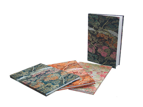 Four brocade notebooks in a variety of beautiful designs