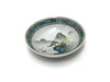 Landscape design of sea and mountains in a turquoise sauce dish