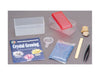 Contents of the crystal growing box kit: crystal formula, base rock, growing tray, magnifying glass, spatula and instructions