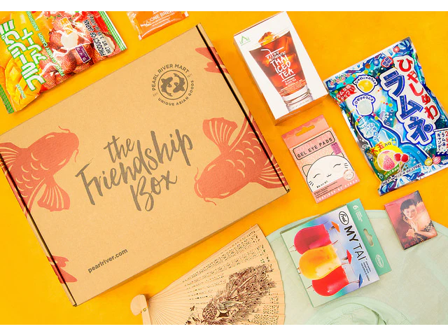 Friendship Box with candy, instant Thai iced tea, eye mask, fan