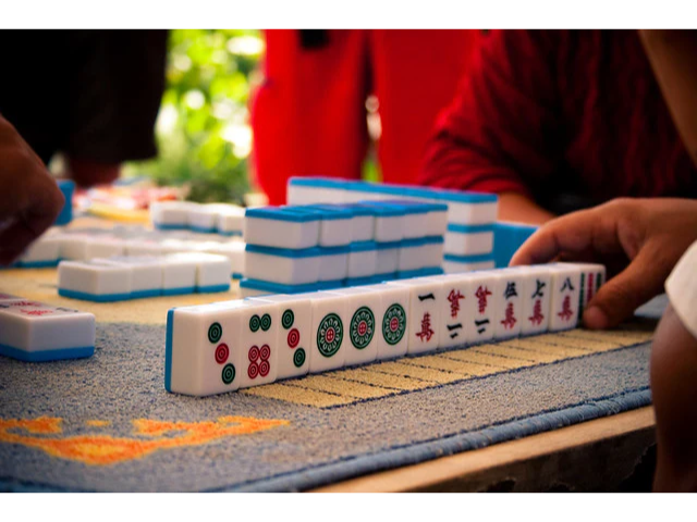 A player's mahjong hand on a table