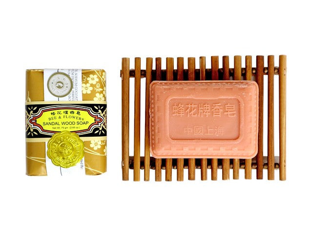 Bee and Flower sandalwood soap in package and on bamboo soap dish