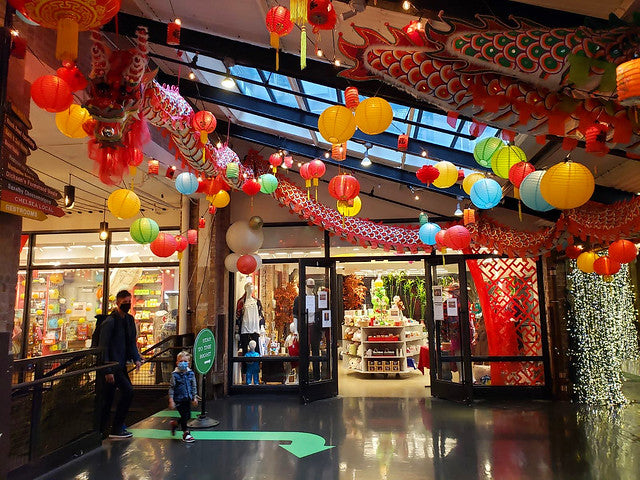 Outside of Pearl River Mart at Chelsea Market with dragon and lantern decor