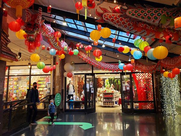 Outside of Pearl River Mart at Chelsea Market with dragon and lantern decor