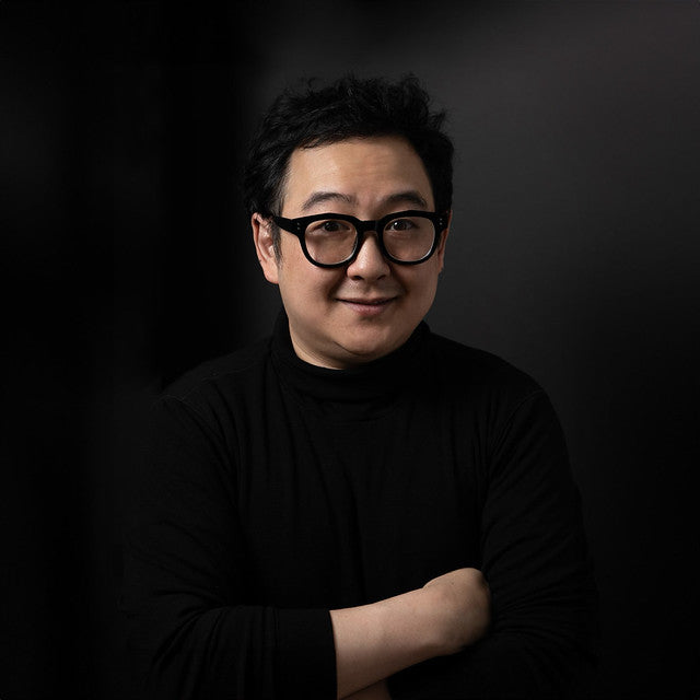 Dan Ahn wearing glasses in black sweater