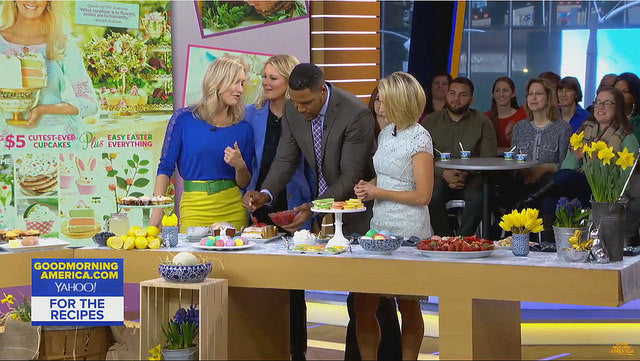 Hosts of Good Morning American behind table with bowls and fruit