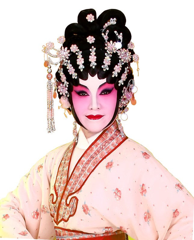 Woman dressed in extravagant Chinese opera makeup and costume