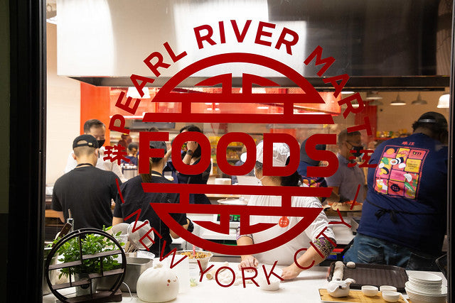 Pearl River Mart Foods logo on window of store