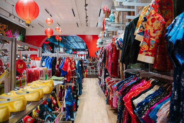 Clothing, shoes, and lanterns in Pearl River Mart's 452 Broadway location