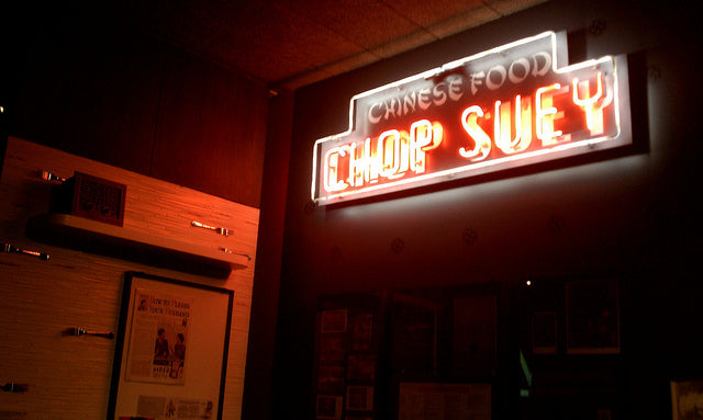 A neon sign of a chop suey restaurant in an exhibit at the Museum of Chinese in America