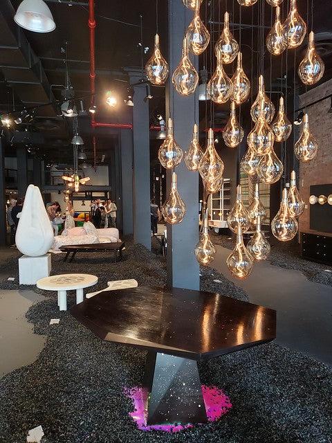 Next Level's NYCxDesign 2019 gallery space with beautiful contemporary chandelier and furniture