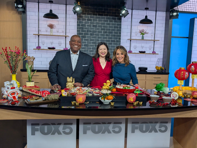 Joanne Kwong with Rosanna Scotto and Curt Menefee on Good Day New York behind Lunar New Year table