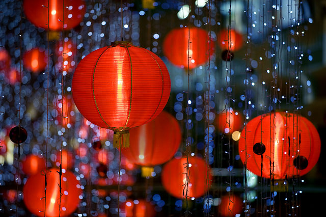 Red lanterns lit up among small tinkling white lights