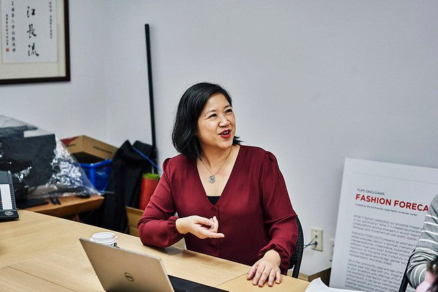 Joanne Kwong having a meeting in a conference room