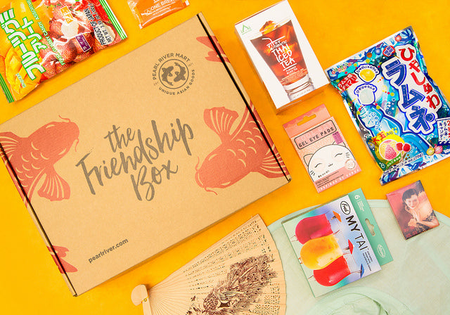 Friendship Box with candy, instant Thai iced tea, eye mask, fan