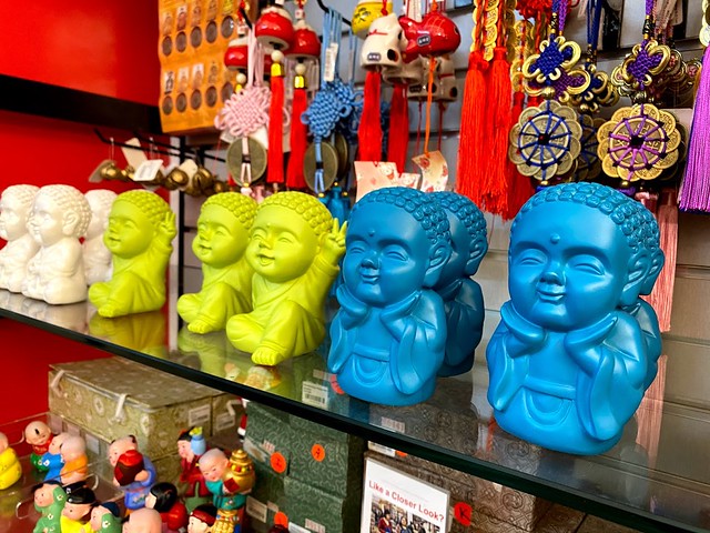 Blue, green, and white mini buddhas