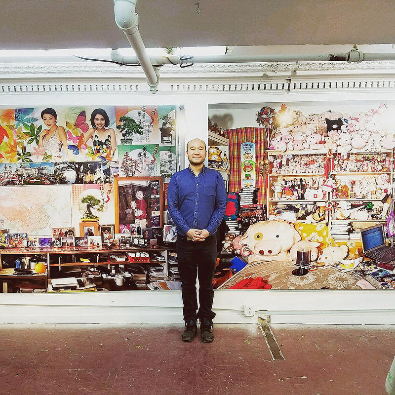 Artist Louis Chan in front of one of his large-scale photographs
