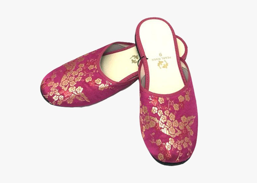 Pair of pink slippers with gold floral design