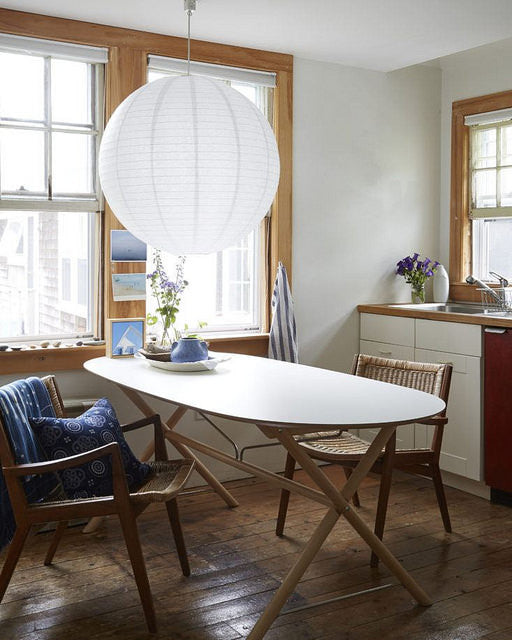 Large white lantern above kitchen table