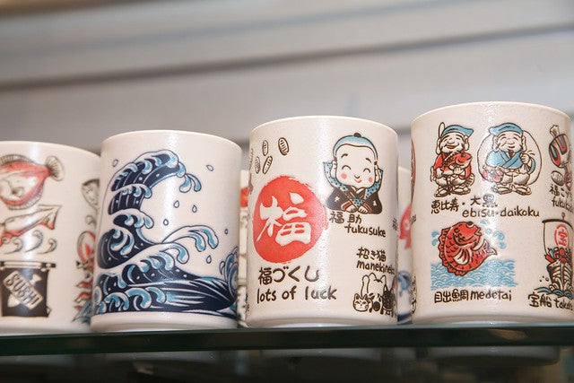 Array of tea cups on shelf
