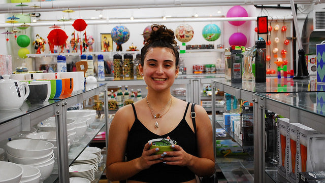 College student Ruby poses with a green bowl in Pearl River