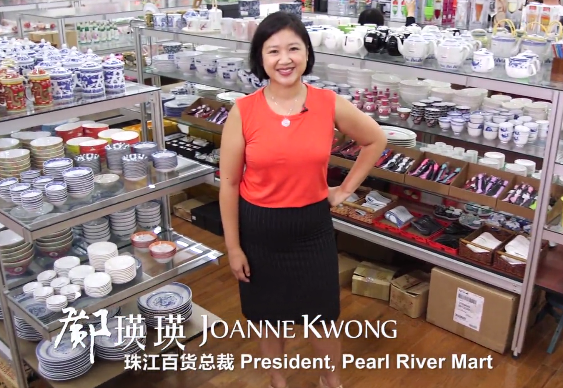 Pearl River Mart President Joanne Kwong surrounded by ceramics at Pearl River Mart