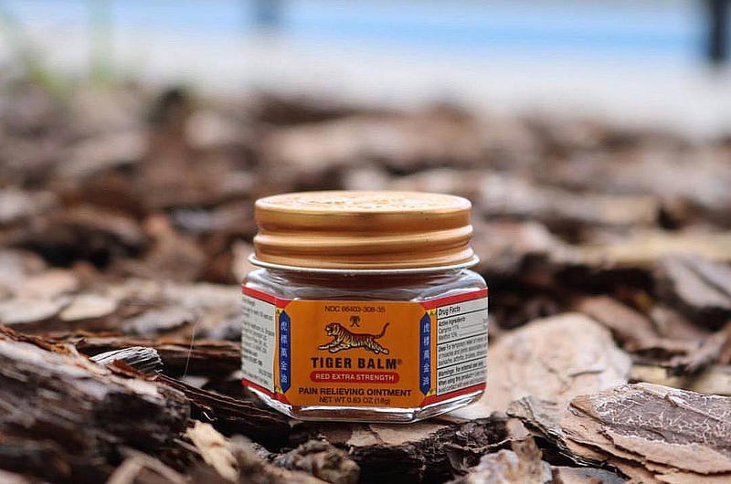 Jar of Tiger Balm on the ground