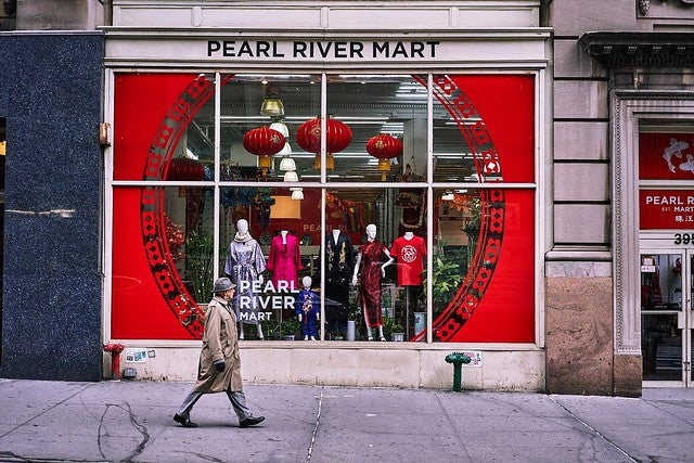 Exterior of Pearl River Mart flagship in Tribeca with man walking in front