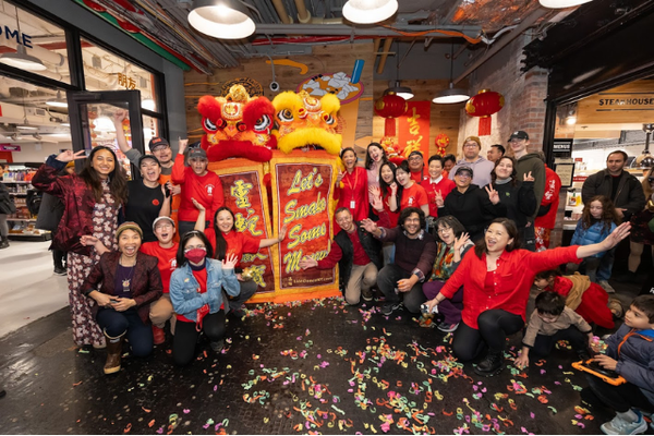 Group of people in front of Lunar New Year lions