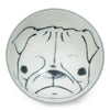 White ceramic bowl with a simple black line drawing of a pug's face at the bottom, creating a playful and charming impression.