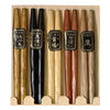 A set of five wooden chopsticks in a light beige cardboard, featuring different natural wood tones and black labels with Japanese characters.